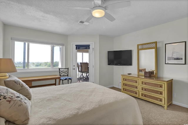 1912 Goose Creek Rd SW Unit 4302, Ocean Isle Beach, NC 28469 - bedroom featuring a textured ceiling, baseboards, ceiling fan, and carpet