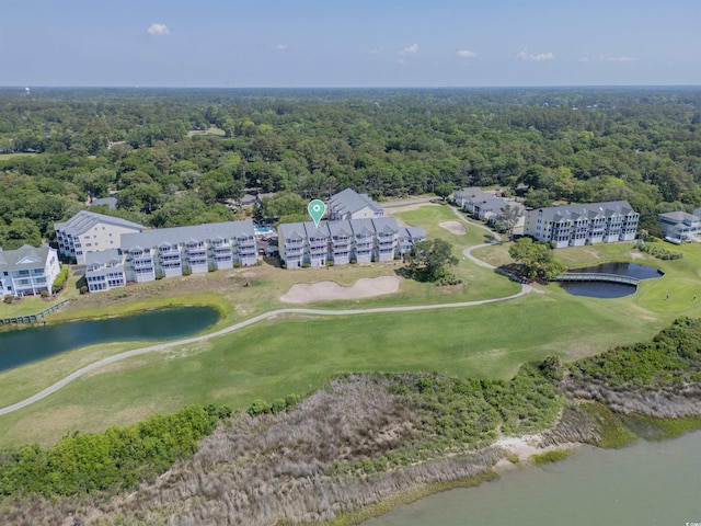1912 Goose Creek Rd SW Unit 4302, Ocean Isle Beach, NC 28469 - drone / aerial view of a large body of water, apartment complex, a local golf course, and a heavily wooded area