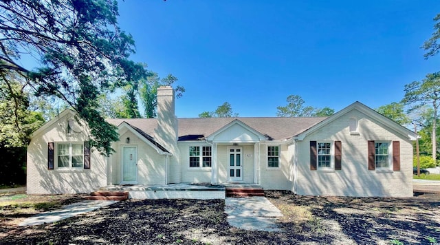 401 S Nichols St, Nichols, SC 29581 - single story home with a chimney and brick siding