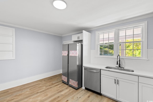 401 S Nichols St, Nichols, SC 29581 - kitchen with stainless steel appliances, a sink, ornamental molding, backsplash, and white cabinetry