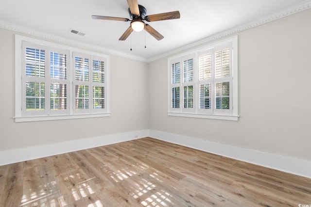 401 S Nichols St, Nichols, SC 29581 - empty room featuring ornamental molding, baseboards, wood finished floors, and a ceiling fan