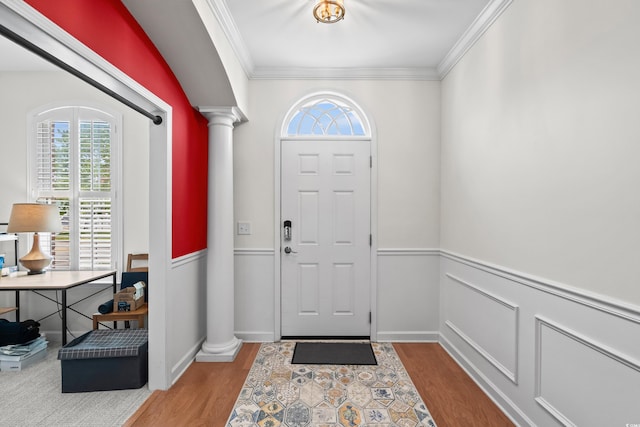 861 Murray Ave, Myrtle Beach, SC 29577 - foyer entrance featuring ornate columns, plenty of natural light, wood finished floors, crown molding, and a wainscoted wall