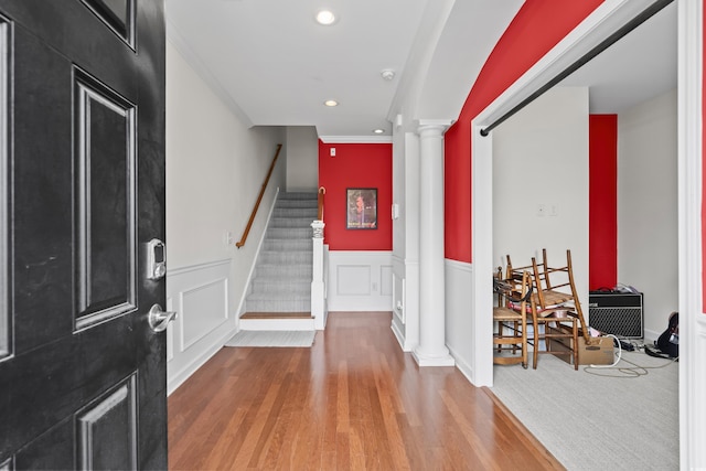 861 Murray Ave, Myrtle Beach, SC 29577 - foyer entrance featuring ornate columns, crown molding, a wainscoted wall, wood finished floors, and stairs