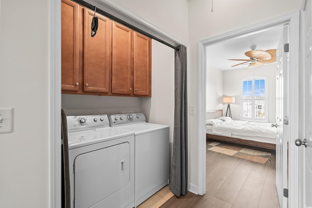 861 Murray Ave, Myrtle Beach, SC 29577 - washroom featuring cabinet space, washing machine and clothes dryer, ceiling fan, and light wood-type flooring