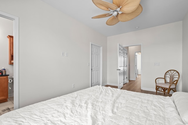 861 Murray Ave, Myrtle Beach, SC 29577 - bedroom with wood finished floors, baseboards, ensuite bath, and ceiling fan