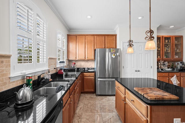861 Murray Ave, Myrtle Beach, SC 29577 - kitchen featuring freestanding refrigerator, ornamental molding, a sink, brown cabinetry, and backsplash