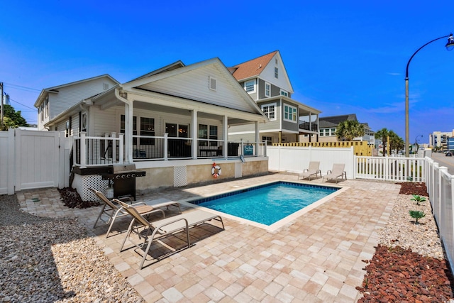 1616 S Ocean Blvd, North Myrtle Beach, SC 29582 - view of pool featuring a fenced backyard, a patio, a gate, and a grill
