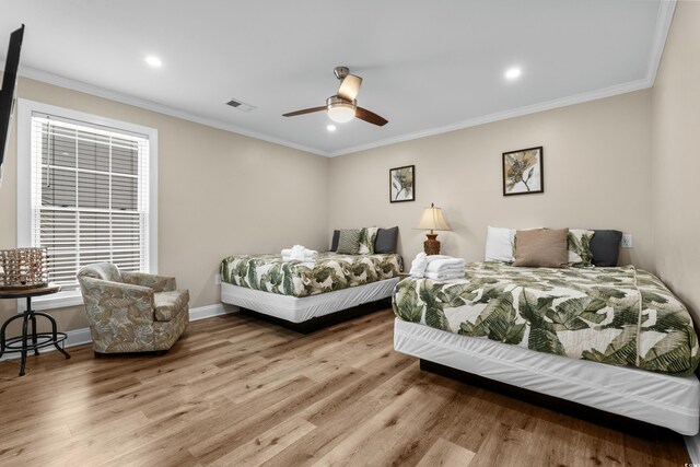1616 S Ocean Blvd, North Myrtle Beach, SC 29582 - bedroom with wood finished floors, crown molding, baseboards, recessed lighting, and a ceiling fan