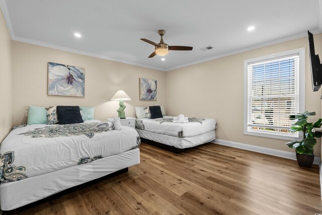 1616 S Ocean Blvd, North Myrtle Beach, SC 29582 - bedroom featuring wood finished floors, baseboards, crown molding, recessed lighting, and ceiling fan