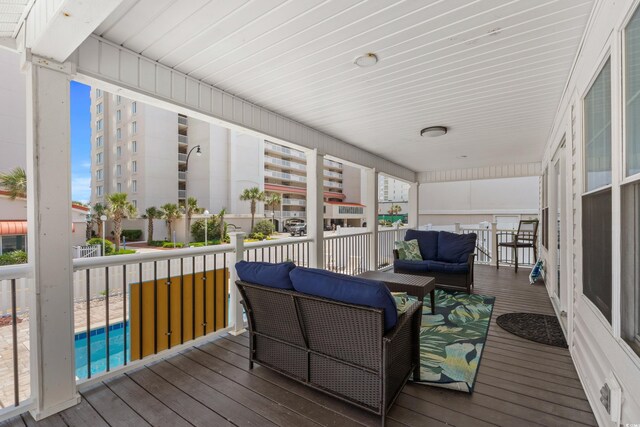 1616 S Ocean Blvd, North Myrtle Beach, SC 29582 - wooden terrace featuring an outdoor living space