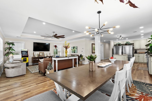 1616 S Ocean Blvd, North Myrtle Beach, SC 29582 - dining space with light wood finished floors, ceiling fan, recessed lighting, crown molding, and a raised ceiling