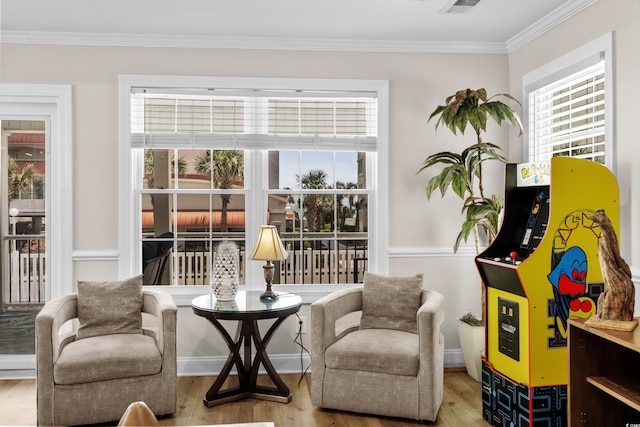 1616 S Ocean Blvd, North Myrtle Beach, SC 29582 - living area featuring wood finished floors, plenty of natural light, crown molding, and baseboards