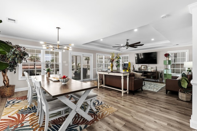1616 S Ocean Blvd, North Myrtle Beach, SC 29582 - dining area with a tray ceiling, ornamental molding, plenty of natural light, light wood-style floors, and recessed lighting