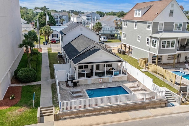 1616 S Ocean Blvd, North Myrtle Beach, SC 29582 - back of house with a residential view, a fenced backyard, and a patio