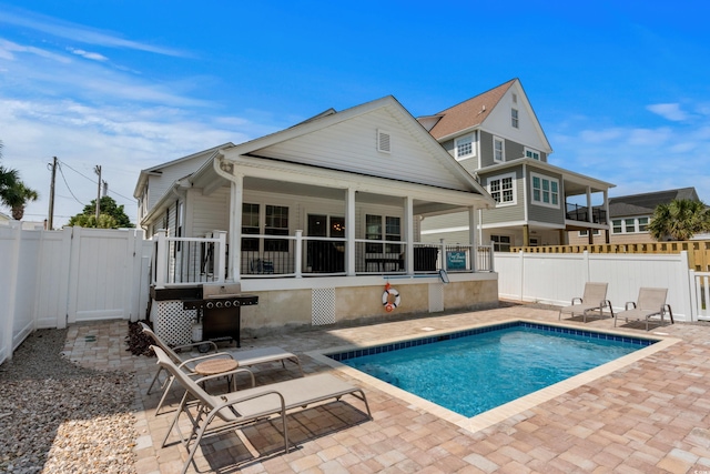 1616 S Ocean Blvd, North Myrtle Beach, SC 29582 - back of property featuring a patio, a fenced backyard, and a gate