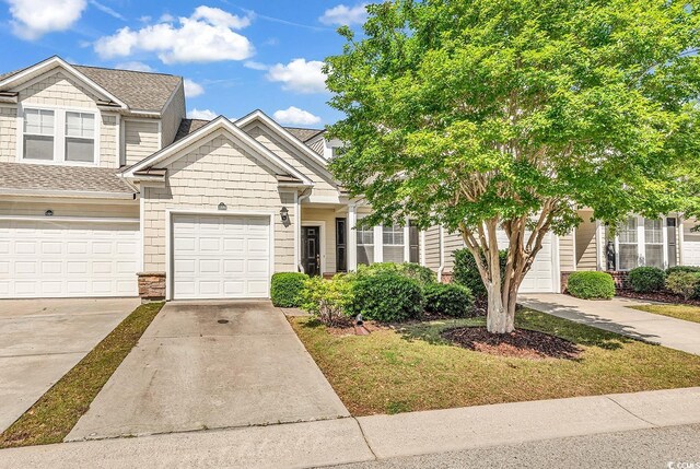 101 Culpepper Way Unit 1006, Myrtle Beach, SC 29579 - view of property featuring driveway, roof with shingles, and a garage