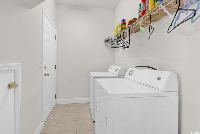 101 Culpepper Way Unit 1006, Myrtle Beach, SC 29579 - laundry area featuring washing machine and dryer, baseboards, and light tile patterned floors