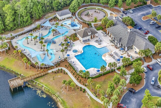 101 Culpepper Way Unit 1006, Myrtle Beach, SC 29579 - drone / aerial view of a pool area and a large body of water