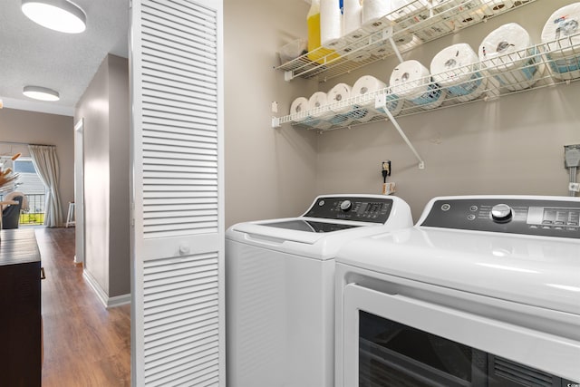 210 Double Eagle Dr Unit B-2, Surfside Beach, SC 29575 - laundry room with washing machine and clothes dryer, wood finished floors, and baseboards