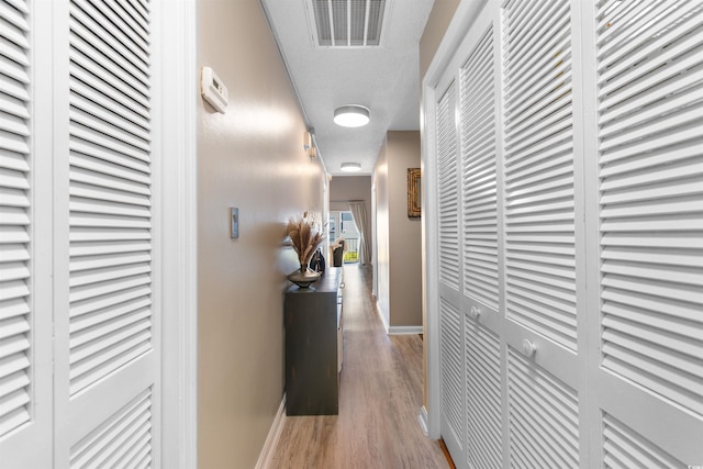 210 Double Eagle Dr Unit B-2, Surfside Beach, SC 29575 - hall featuring baseboards and wood finished floors