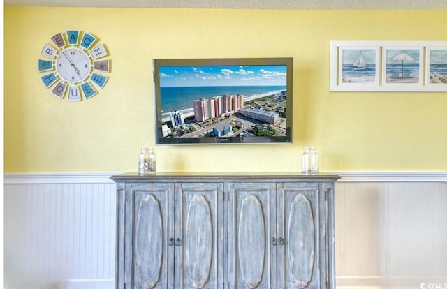 2801 S Ocean Blvd Unit 538, North Myrtle Beach, SC 29582 - detailed view of a wainscoted wall, a dry bar, and a decorative wall