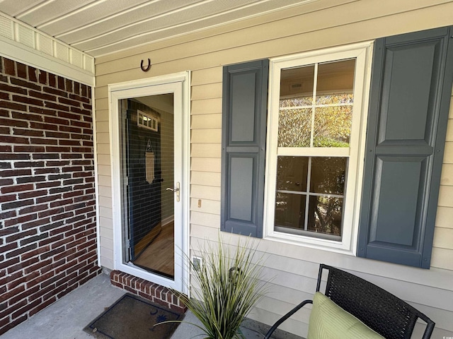 107 Pawleys Place Dr Unit 107, Pawleys Island, SC 29585 - entrance to property featuring brick siding and covered porch