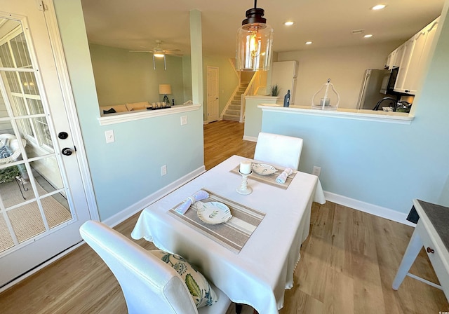 107 Pawleys Place Dr Unit 107, Pawleys Island, SC 29585 - dining room with stairs, light wood finished floors, recessed lighting, a ceiling fan, and baseboards