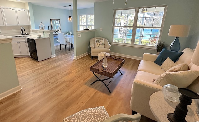 107 Pawleys Place Dr Unit 107, Pawleys Island, SC 29585 - living room with light wood-type flooring and baseboards