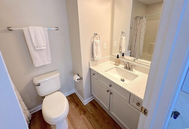 107 Pawleys Place Dr Unit 107, Pawleys Island, SC 29585 - full bath featuring toilet, wood finished floors, vanity, and curtained shower