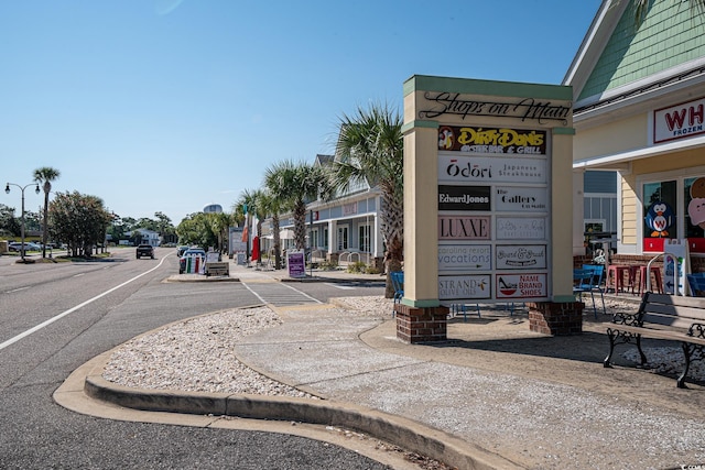 601 Hillside Dr N Unit 2135, North Myrtle Beach, SC 29582 - view of asphalt road featuring sidewalks, street lights, and curbs