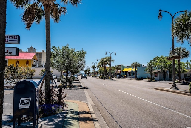 601 Hillside Dr N Unit 2135, North Myrtle Beach, SC 29582 - view of asphalt road featuring street lighting, curbs, and sidewalks