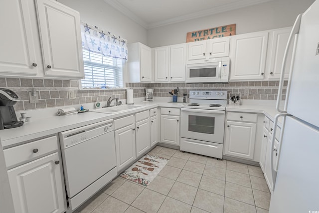 6203 Catalina Dr Unit 1333, North Myrtle Beach, SC 29582 - kitchen featuring white appliances, a sink, backsplash, white cabinetry, and crown molding