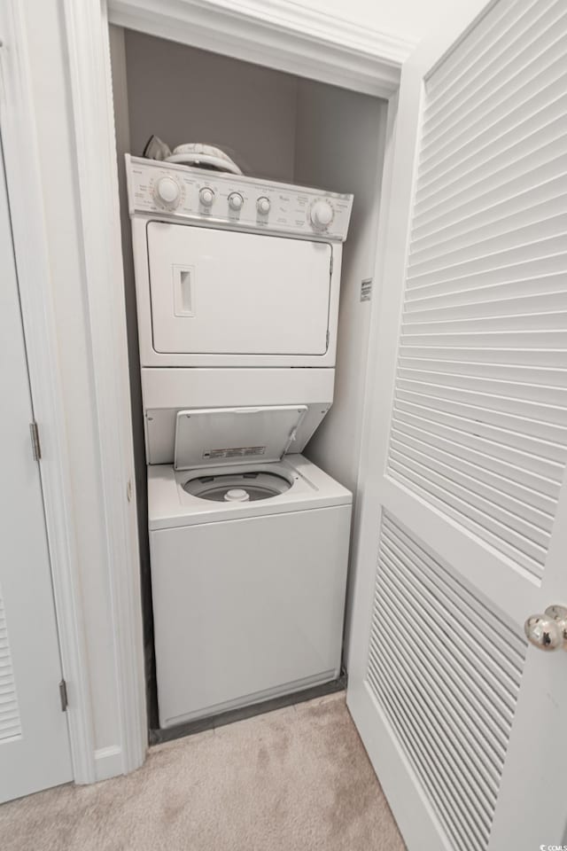 6203 Catalina Dr Unit 1333, North Myrtle Beach, SC 29582 - washroom with estacked washer and dryer and light colored carpet