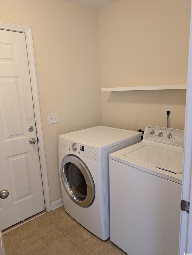 281 Palmetto Glen Dr, Myrtle Beach, SC 29588 - laundry area with washing machine and clothes dryer and light tile patterned flooring