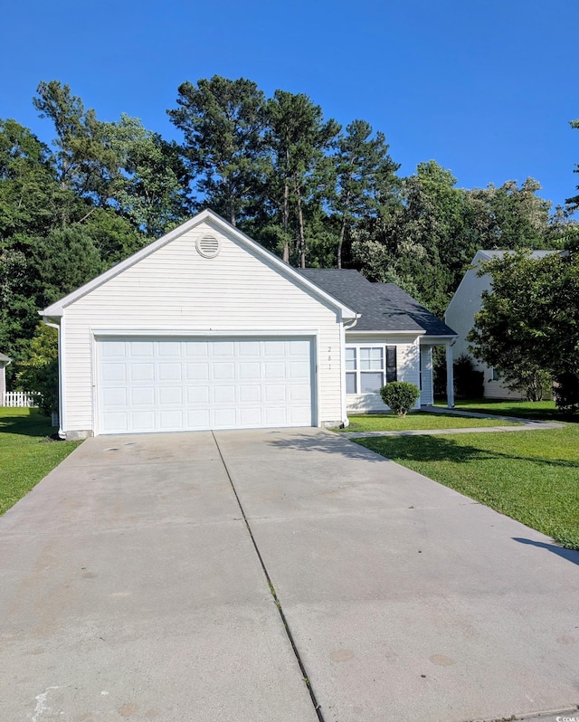281 Palmetto Glen Dr, Myrtle Beach, SC 29588 - view of front of house featuring concrete driveway, a front lawn, and a garage