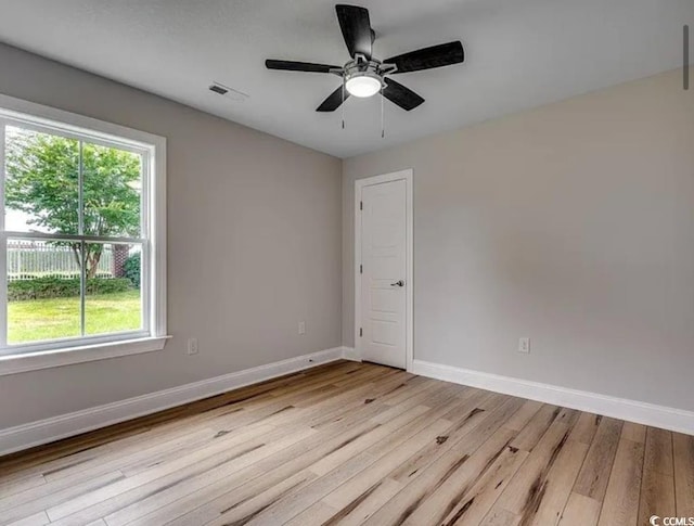 2599 Woodcreek Ln, Conway, SC 29527 - unfurnished room with light wood-style floors, baseboards, and ceiling fan