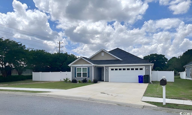 2599 Woodcreek Ln, Conway, SC 29527 - ranch-style home featuring an attached garage, driveway, and a shingled roof