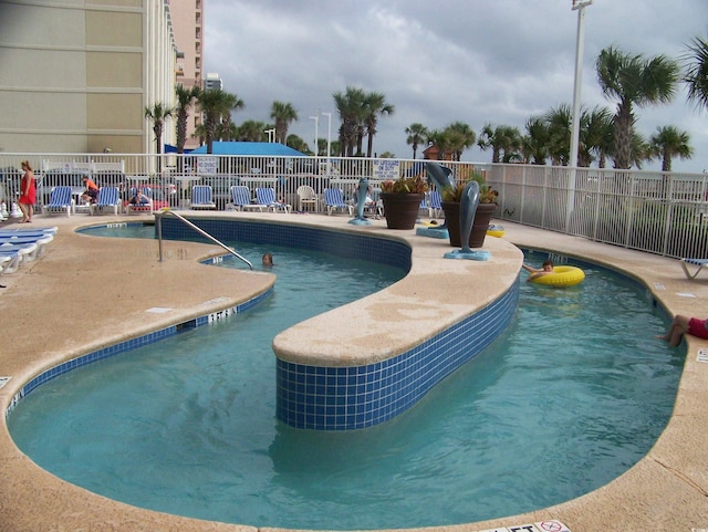 5300 N Ocean Blvd Unit 306, Myrtle Beach, SC 29577 - community pool featuring a patio
