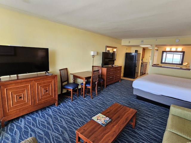5300 N Ocean Blvd Unit 306, Myrtle Beach, SC 29577 - bedroom featuring dark carpet, freestanding refrigerator, and crown molding