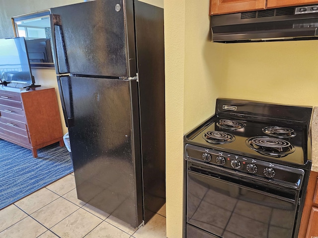 5300 N Ocean Blvd Unit 306, Myrtle Beach, SC 29577 - kitchen with black appliances, under cabinet range hood, and light tile patterned floors