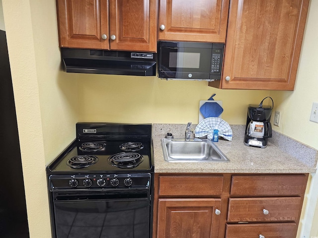 5300 N Ocean Blvd Unit 306, Myrtle Beach, SC 29577 - kitchen featuring black appliances, under cabinet range hood, a sink, light countertops, and brown cabinetry