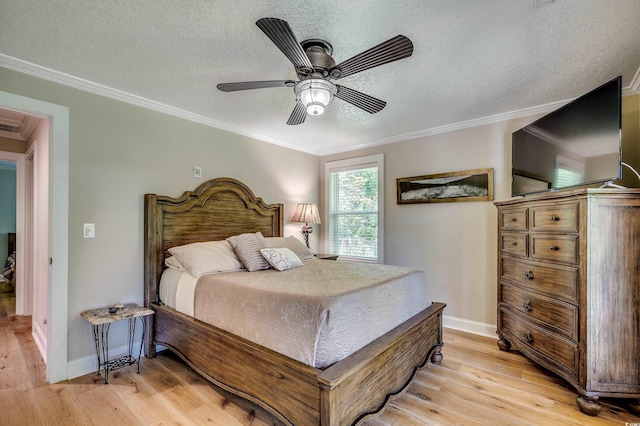 112 Blue Gull Dr, Conway, SC 29526 - bedroom featuring light wood-style flooring, a textured ceiling, crown molding, baseboards, and a ceiling fan