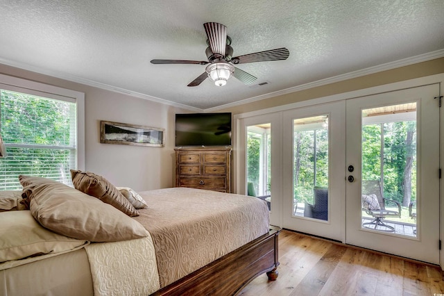 112 Blue Gull Dr, Conway, SC 29526 - bedroom featuring french doors, access to outside, light wood-style flooring, a textured ceiling, and ornamental molding