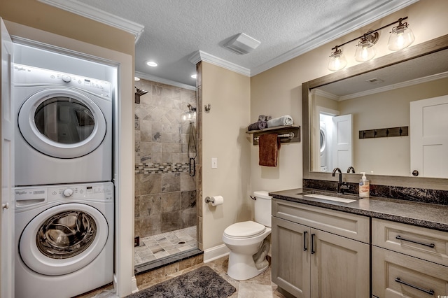 112 Blue Gull Dr, Conway, SC 29526 - bathroom with stacked washer and clothes dryer, a shower stall, vanity, toilet, and crown molding