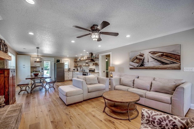112 Blue Gull Dr, Conway, SC 29526 - living area featuring a textured ceiling, light wood finished floors, a ceiling fan, recessed lighting, and ornamental molding