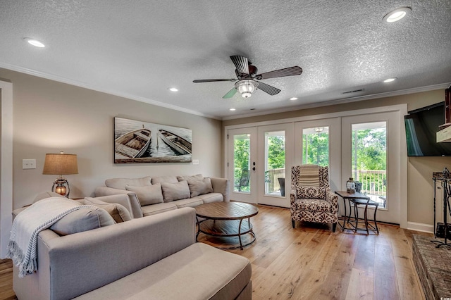 112 Blue Gull Dr, Conway, SC 29526 - living room featuring light wood-type flooring, french doors, ornamental molding, a ceiling fan, and recessed lighting