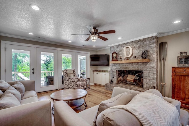 112 Blue Gull Dr, Conway, SC 29526 - living area with plenty of natural light, ceiling fan, light wood-style flooring, crown molding, and a textured ceiling