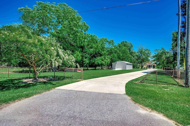 112 Blue Gull Dr, Conway, SC 29526 - view of community with an outdoor structure, view of scattered trees, and a detached garage
