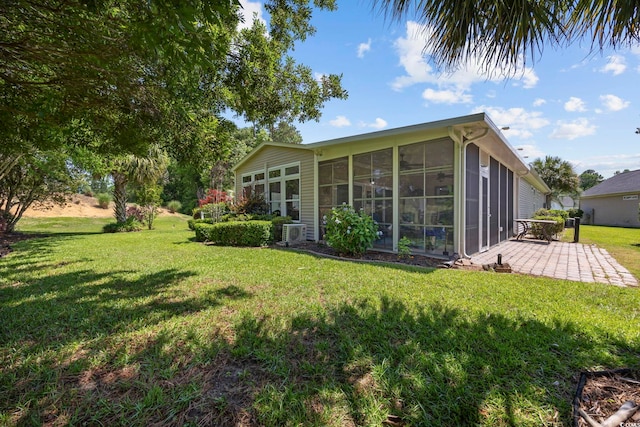 7005 Wellesley Ct, Murrells Inlet, SC 29576 - back of house with a sunroom, a yard, and a patio