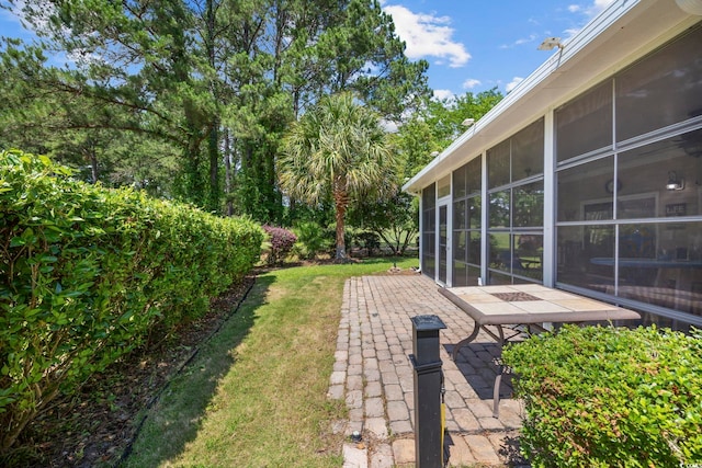 7005 Wellesley Ct, Murrells Inlet, SC 29576 - view of green lawn with a patio area and a sunroom